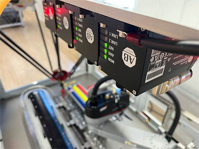 ArmorKinetix distributed servo drives control motors on a delta robot. Based on SiC technology, the drives experience less power loss and less need for heat dissipation. Source: Rockwell Automation ArmorKinetix distributed servo drives control motors on a delta robot. Based on SiC technology, the drives experience less power loss and less need for heat dissipation. Source: Rockwell Automation